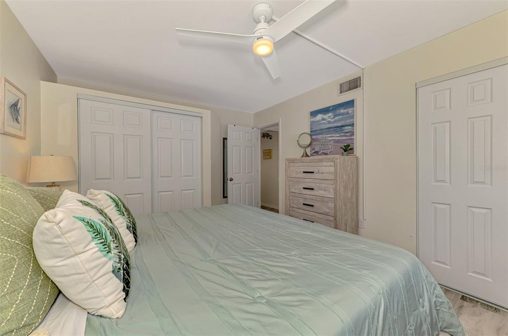 446 Canal Road, Unit 5 Sarasota, FL 34242 - Photo 17 of 64 a bedroom with a bed and a chandelier
