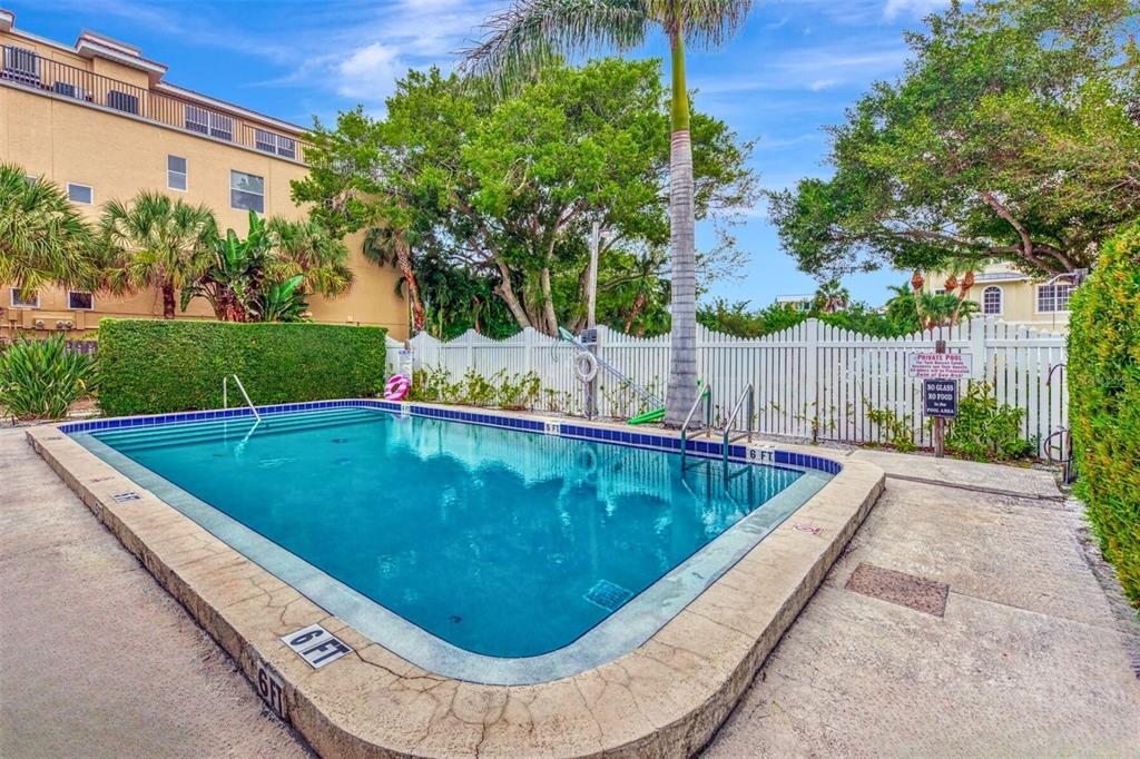 446 Canal Road, Unit 5 Sarasota, FL 34242 - Photo 22 of 64 a view of a swimming pool with a patio