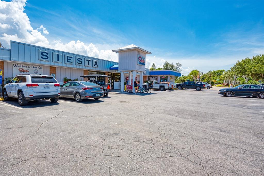 446 Canal Road, Unit 5 Sarasota, FL 34242 - Photo 59 of 64 a view of cars parked in front of a building