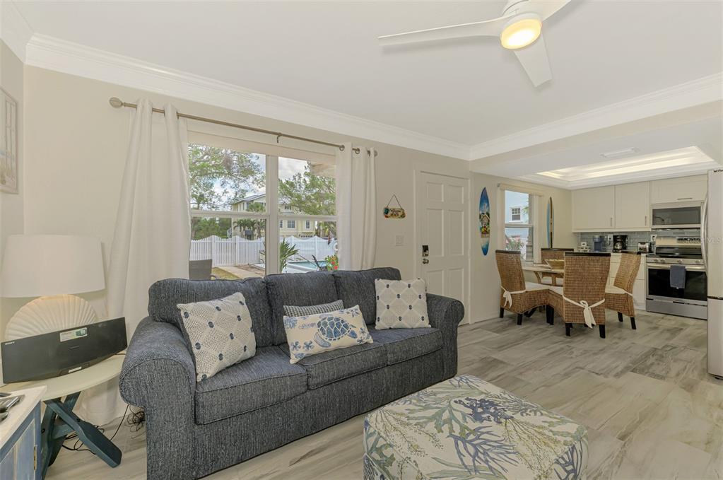 446 Canal Road, Unit 5 Sarasota, FL 34242 - Photo 6 of 64 a living room with furniture and a large window