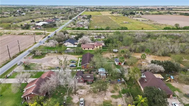 an aerial view of lake and residential houses with outdoor space