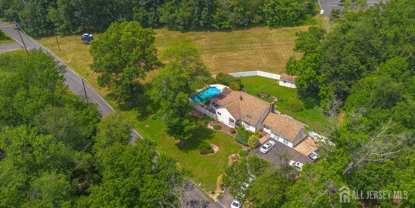 a view of a lake with a yard and mountain view