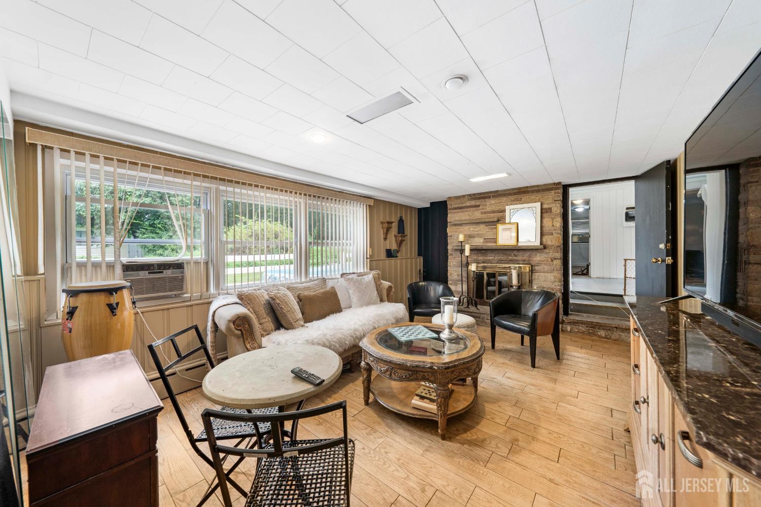 101 Weston Road Somerset, NJ 08873 - Photo 15 of 32 a living room with furniture and a fireplace