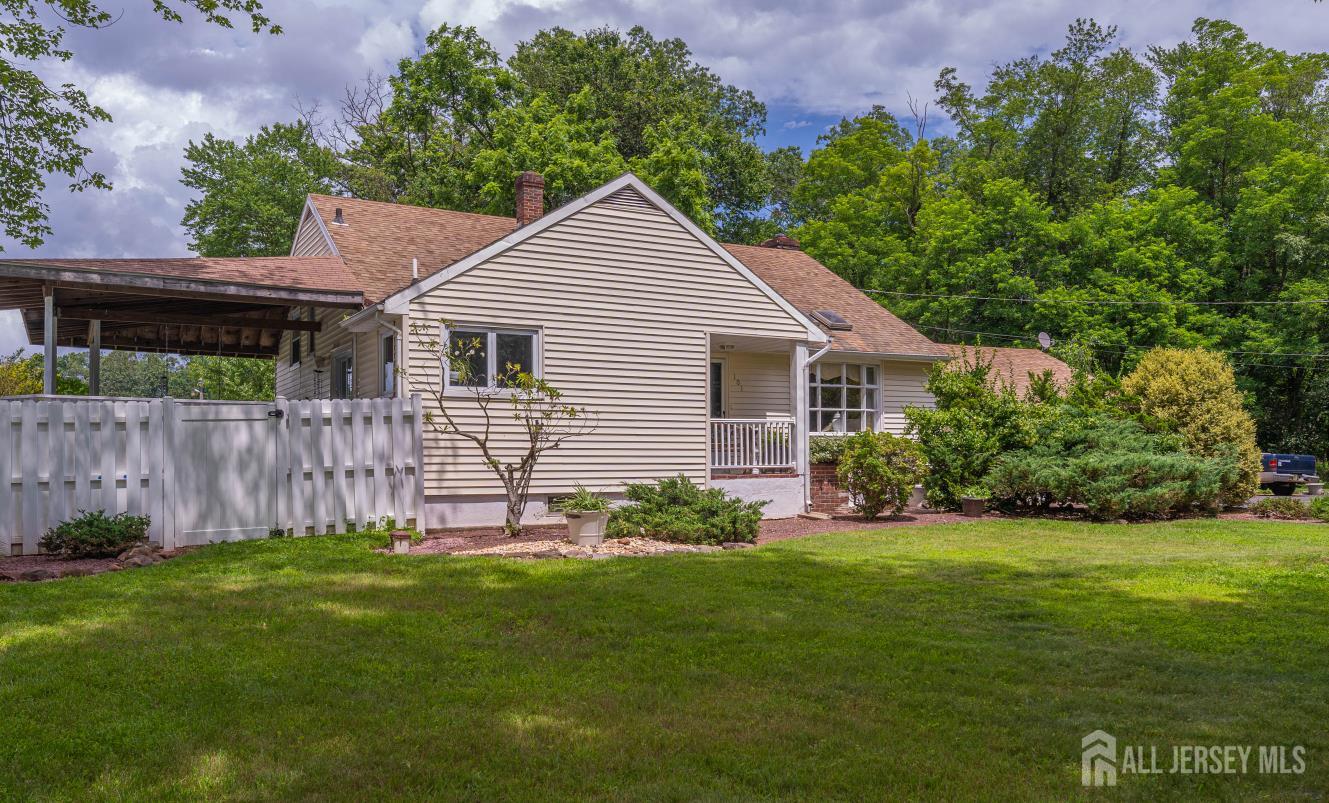 101 Weston Road Somerset, NJ 08873 - Photo 4 of 32 a view of a house with a yard and a garden