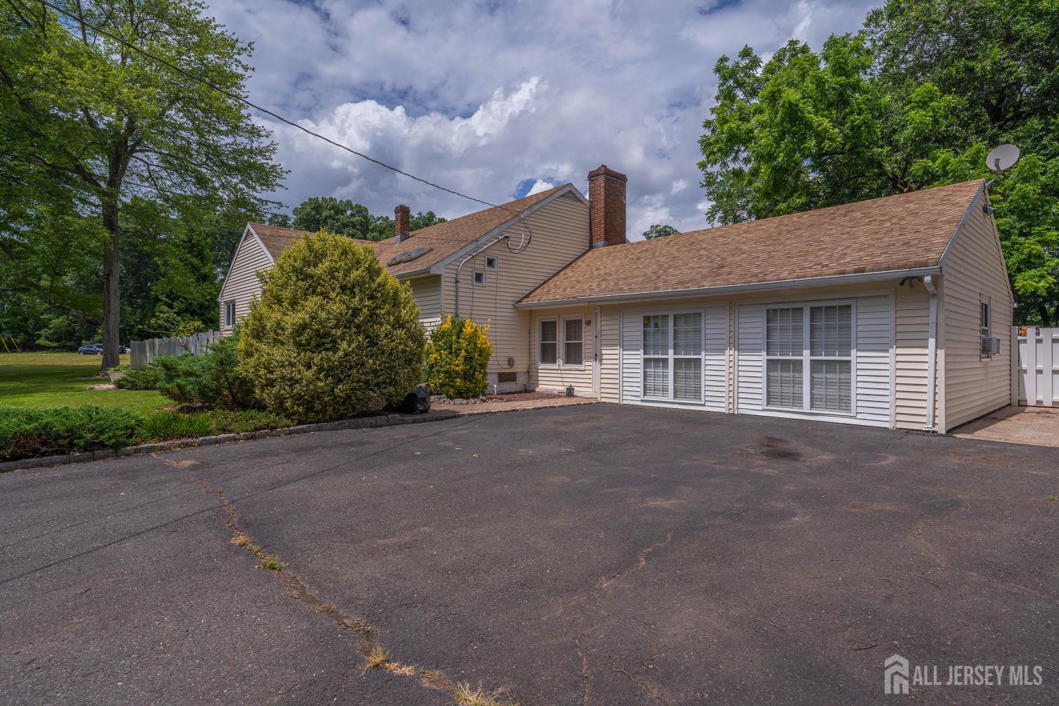 101 Weston Road Somerset, NJ 08873 - Photo 5 of 32 a view of a house with a yard and potted plants