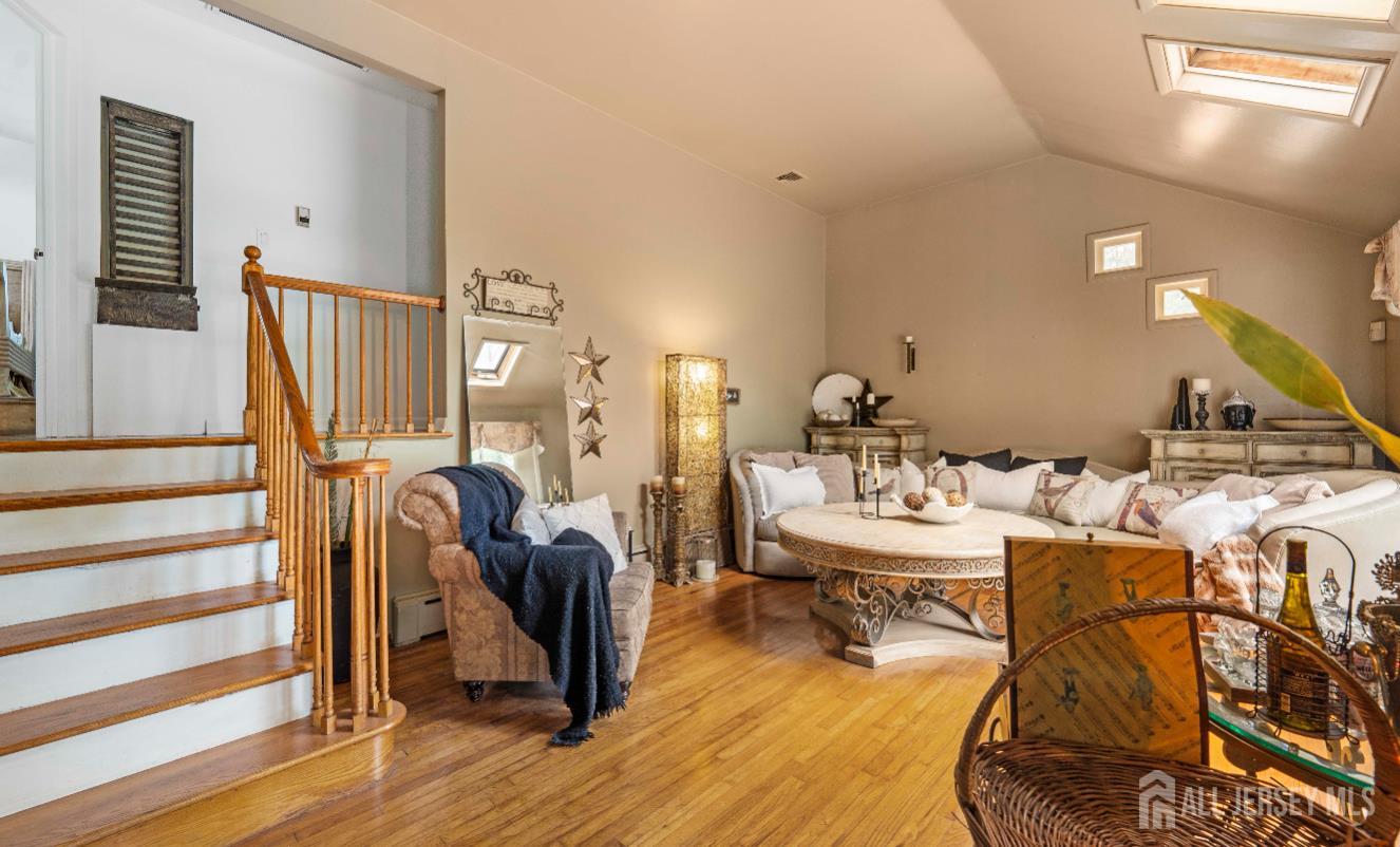 101 Weston Road Somerset, NJ 08873 - Photo 6 of 32 a living room with furniture and wooden floor