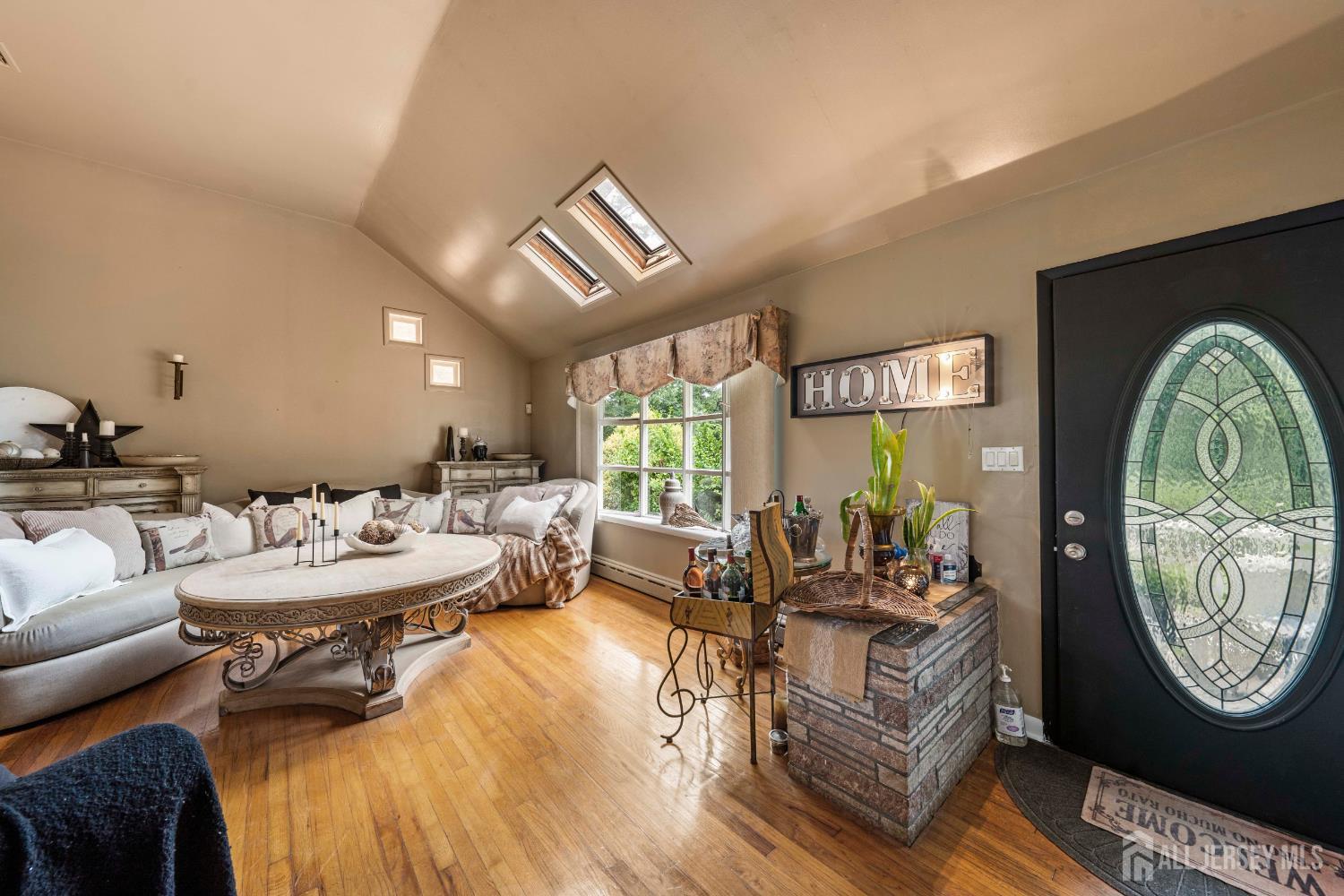 101 Weston Road Somerset, NJ 08873 - Photo 7 of 32 a living room with furniture a window and a clock