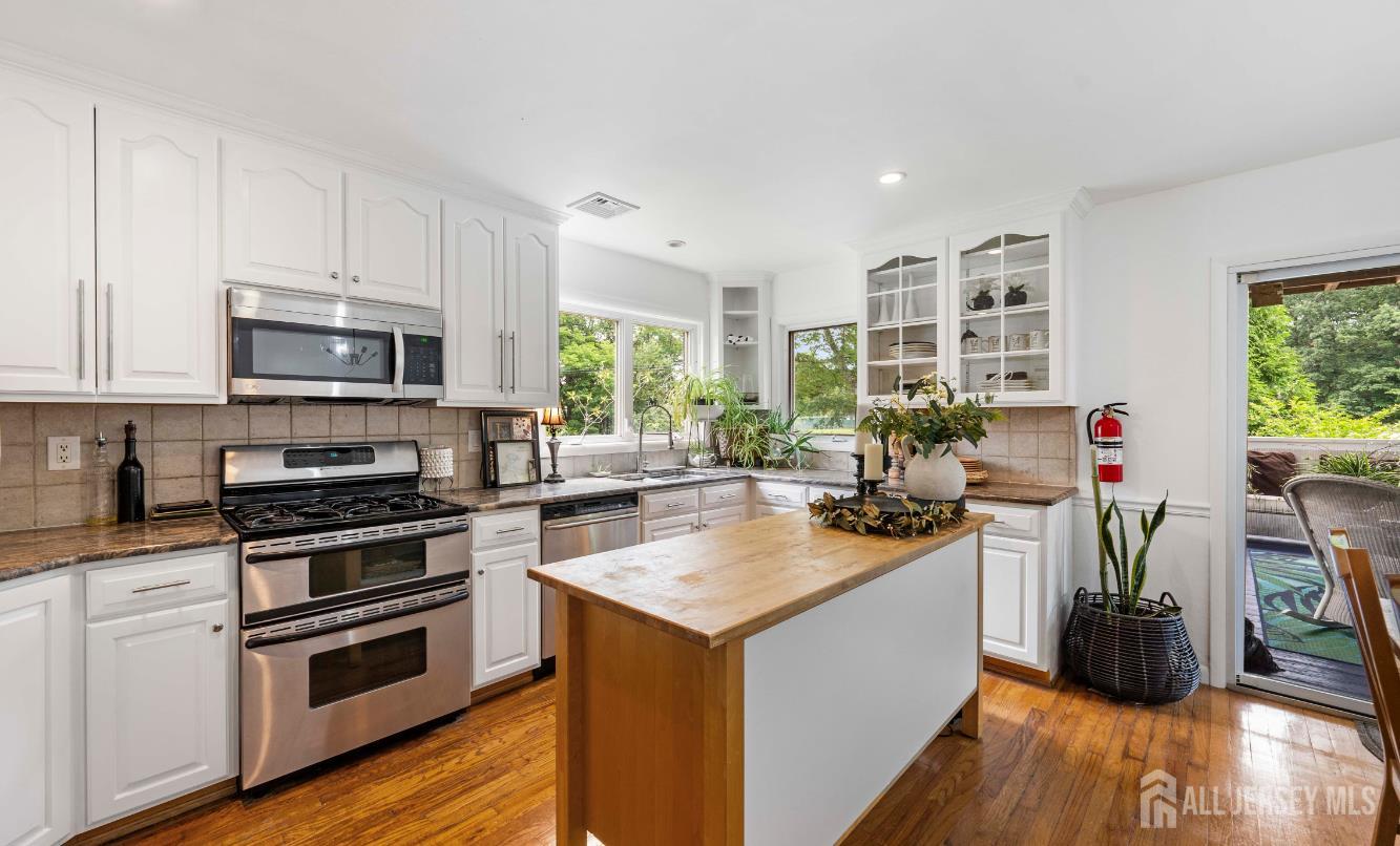 101 Weston Road Somerset, NJ 08873 - Photo 10 of 32 a kitchen with a sink stove and cabinets