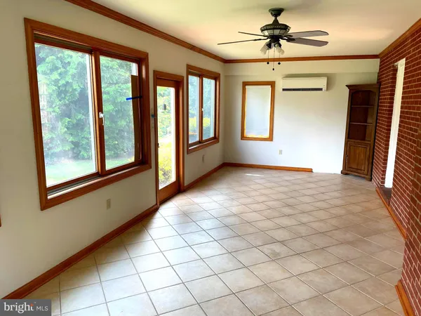 a view of empty room with windows