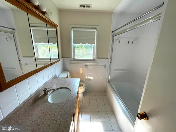 a bathroom with a sink and a shower
