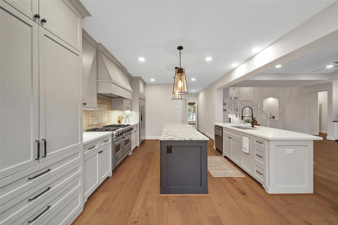 20730 Windrose Bend Drive Spring, TX 77379 - Photo 11 of 45 a large kitchen with stainless steel appliances and a sink