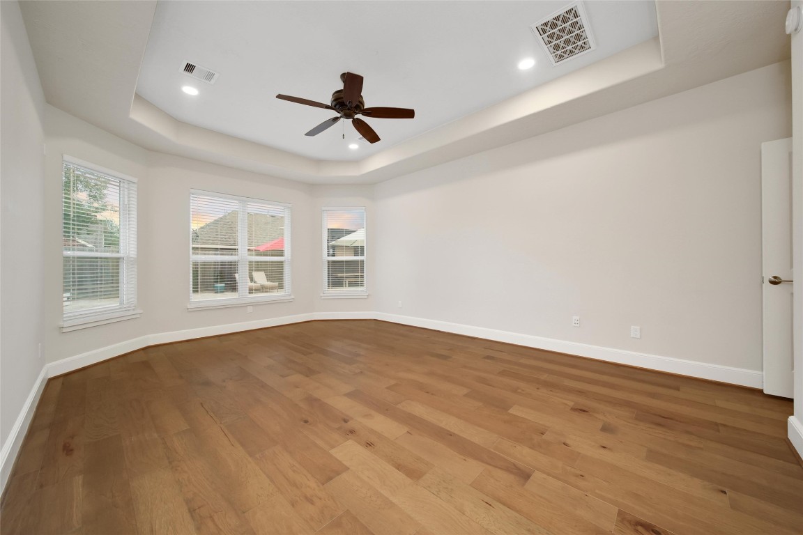 20730 Windrose Bend Drive Spring, TX 77379 - Photo 16 of 45 a view of an empty room with a window and wooden floor
