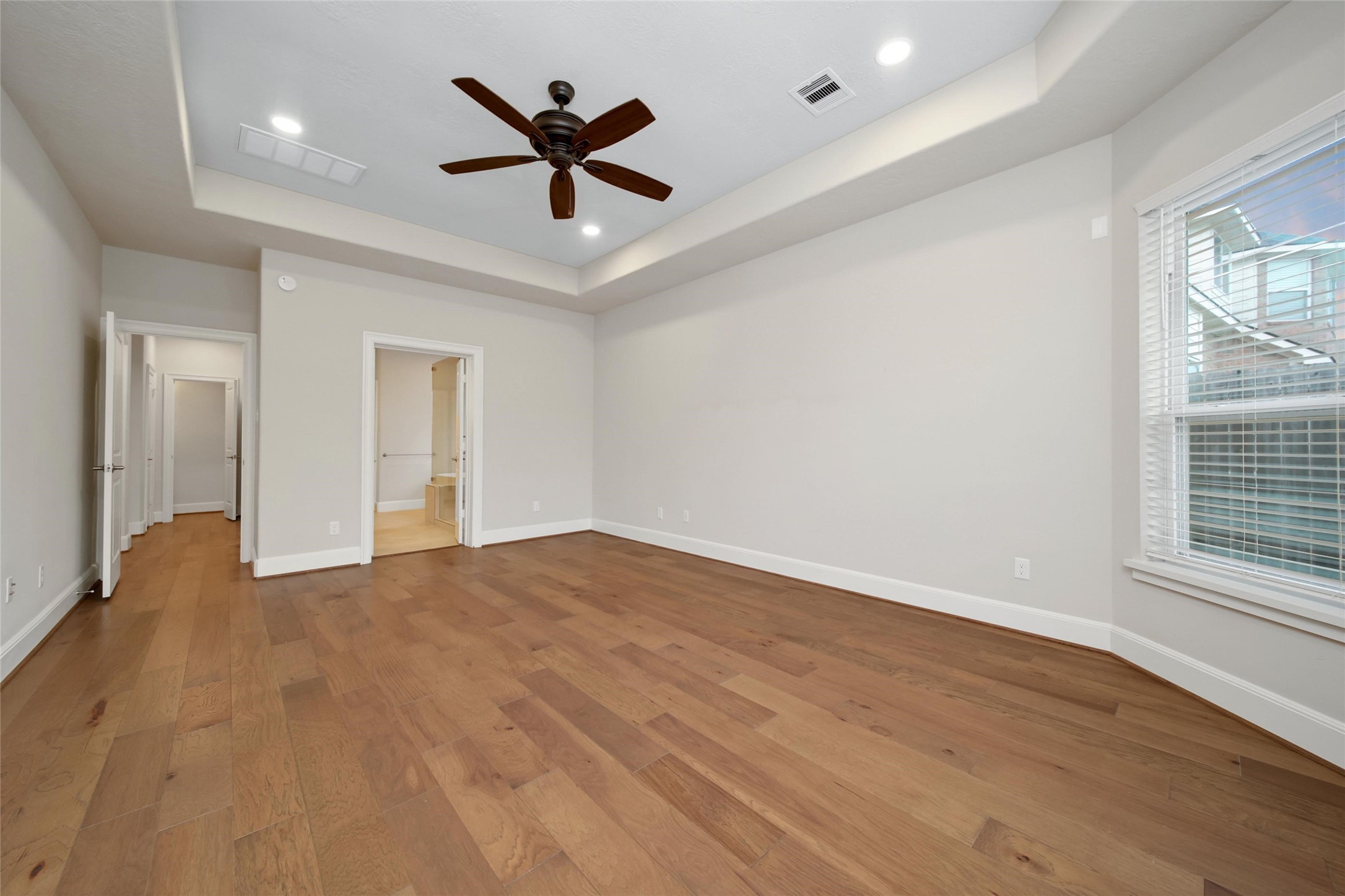 20730 Windrose Bend Drive Spring, TX 77379 - Photo 17 of 45 a view of empty room with wooden floor and fan