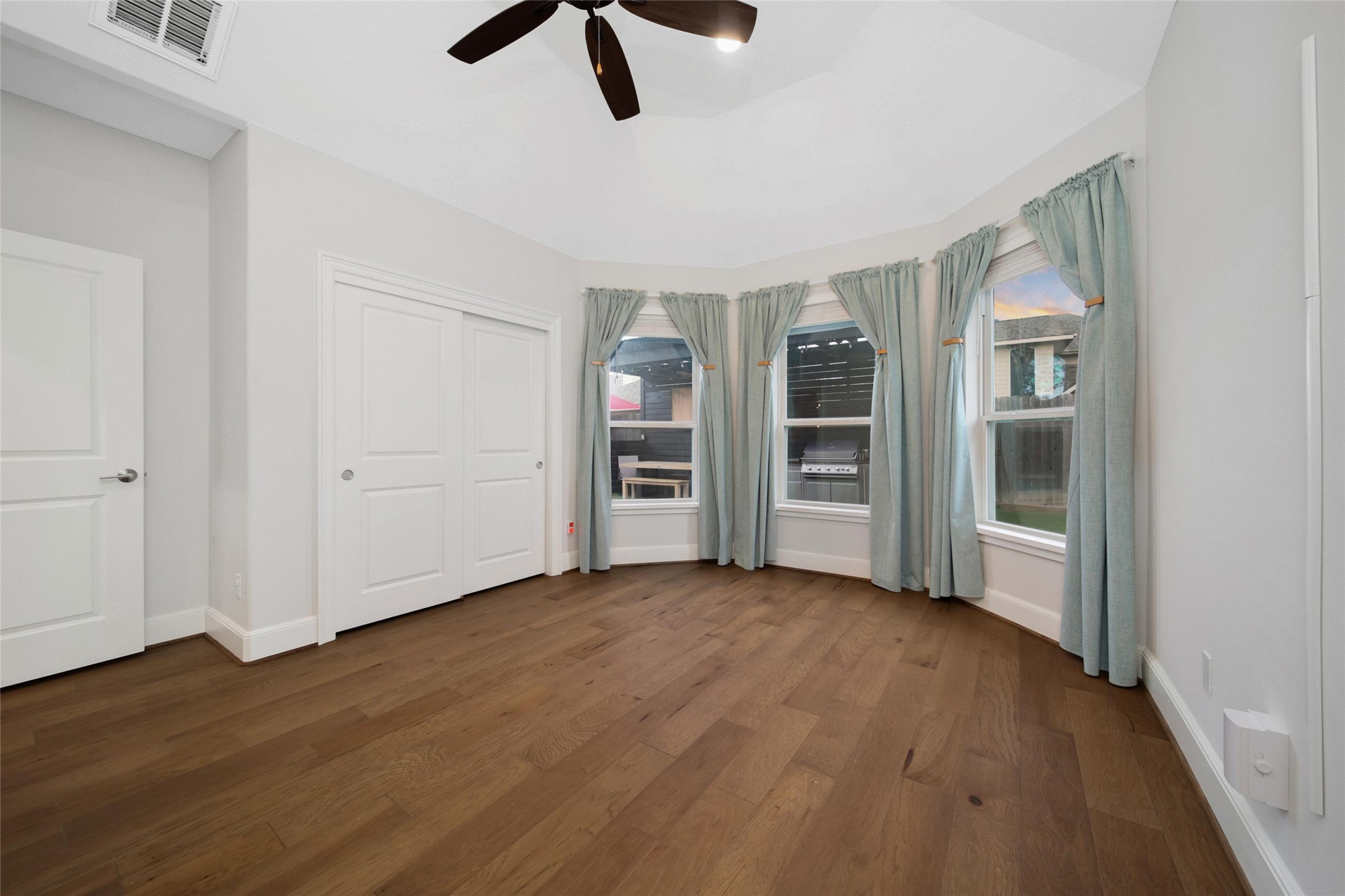20730 Windrose Bend Drive Spring, TX 77379 - Photo 23 of 45 wooden floor in an empty room with a window