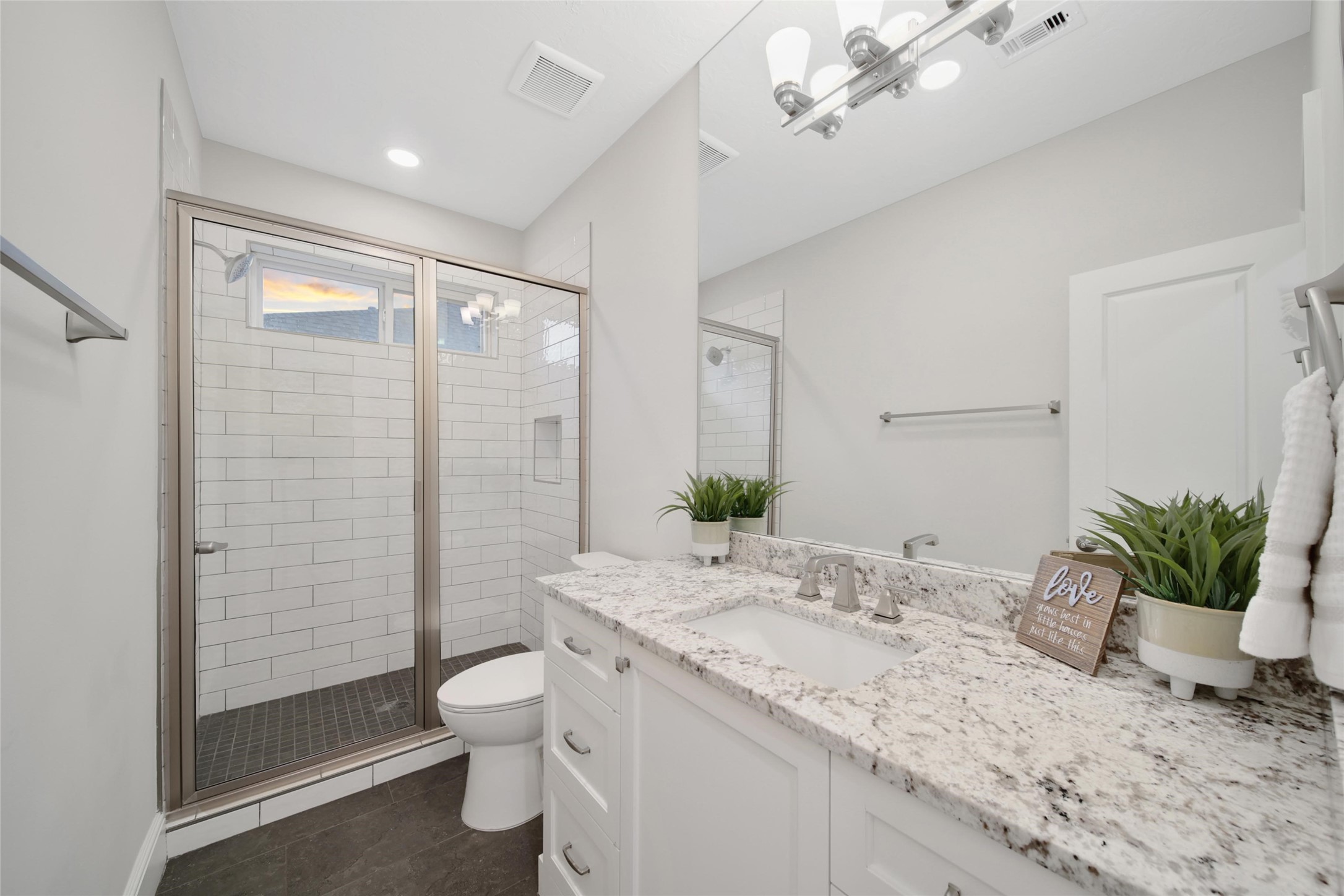 20730 Windrose Bend Drive Spring, TX 77379 - Photo 24 of 45 a bathroom with a granite countertop sink a toilet and shower