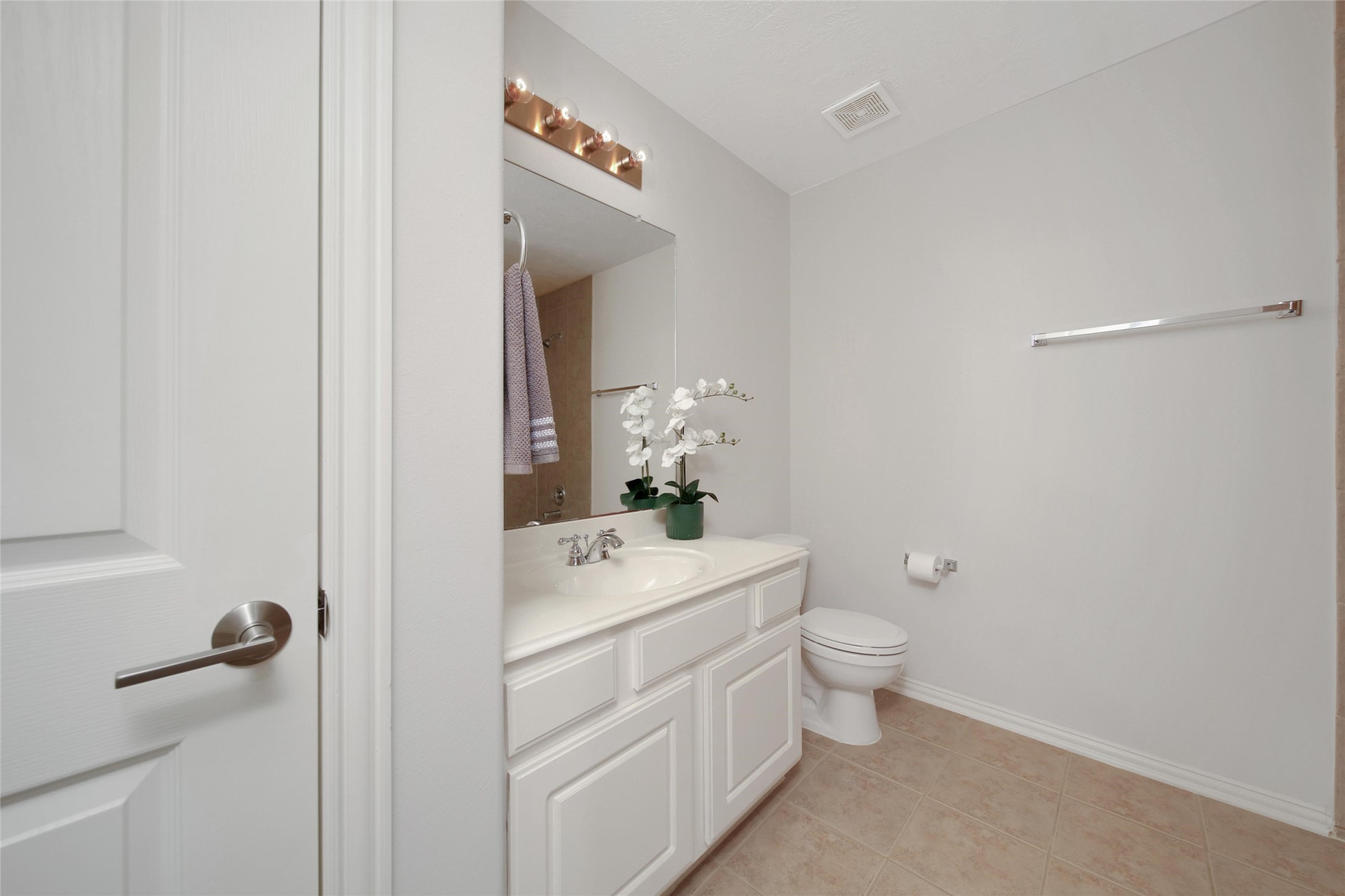 20730 Windrose Bend Drive Spring, TX 77379 - Photo 28 of 45 a bathroom with a granite countertop sink a toilet and a mirror