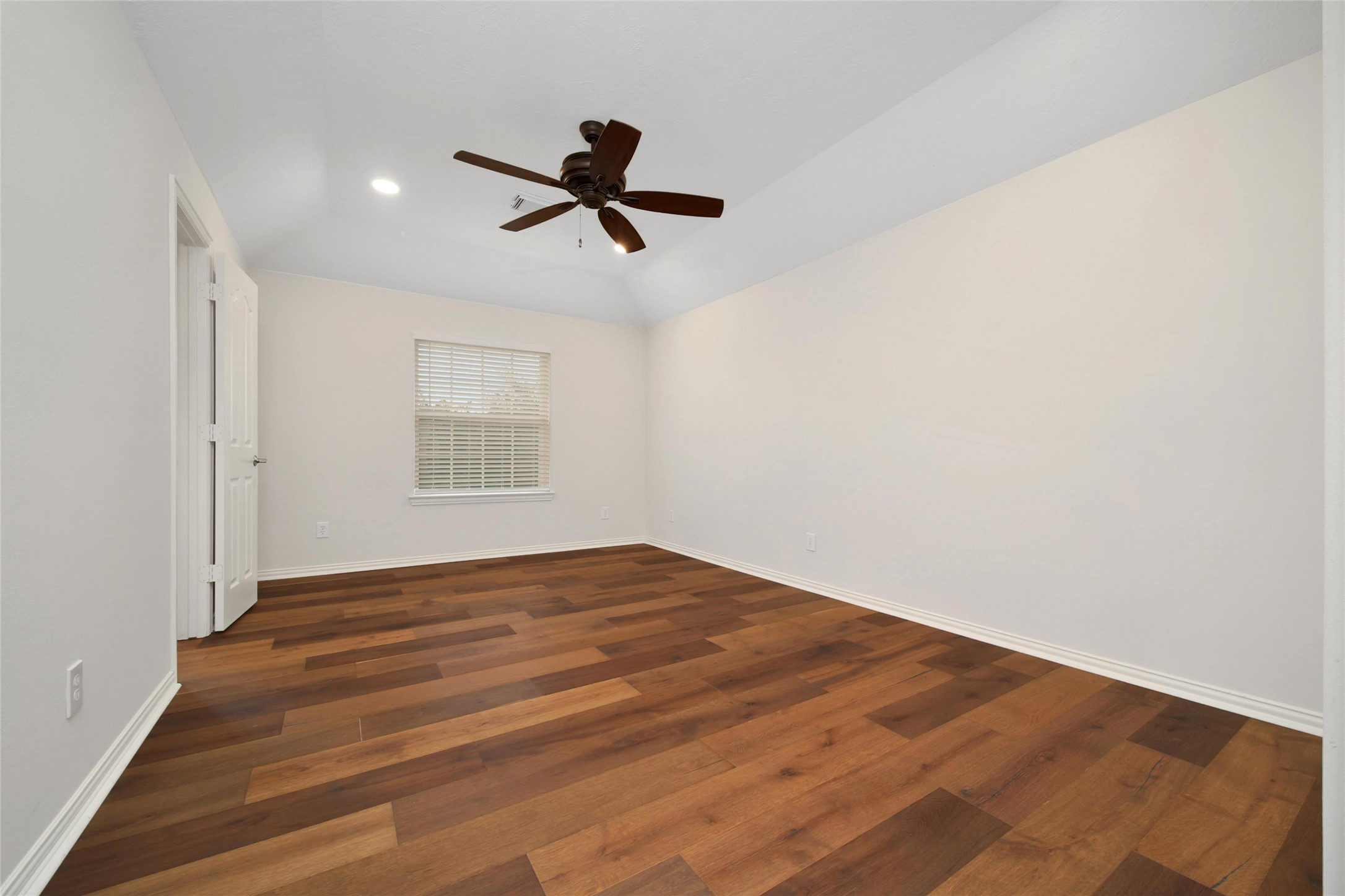 20730 Windrose Bend Drive Spring, TX 77379 - Photo 29 of 45 a view of empty room with wooden floor and ceiling fan