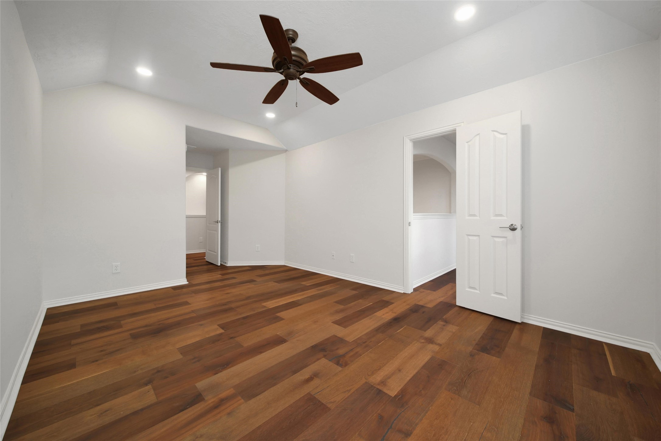 20730 Windrose Bend Drive Spring, TX 77379 - Photo 30 of 45 a view of empty room with wooden floor and ceiling fan