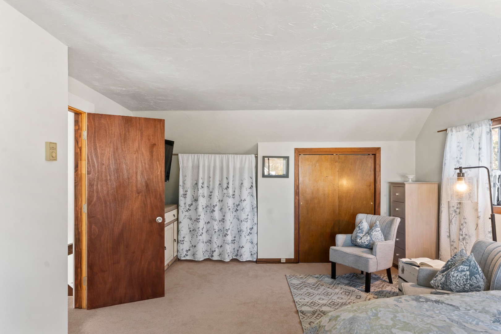 90 Schoolhouse Road Edgartown, MA 02539 - Photo 15 of 21 Large double closet and a lounge area with large screen TV create a private haven.