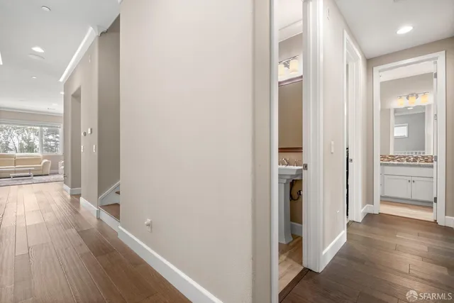 a spacious bedroom with a bed and a mirror