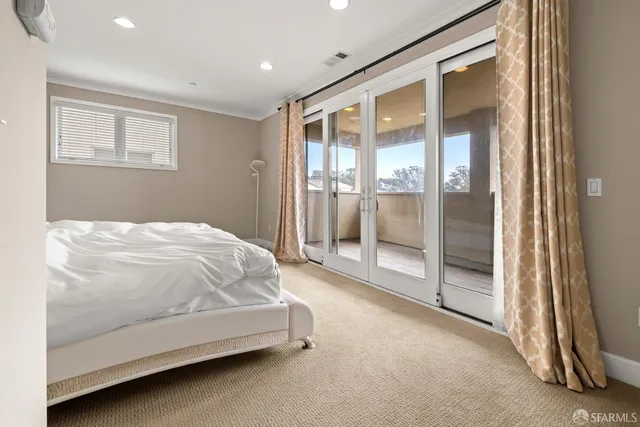 a bed room with a bed and a night stand