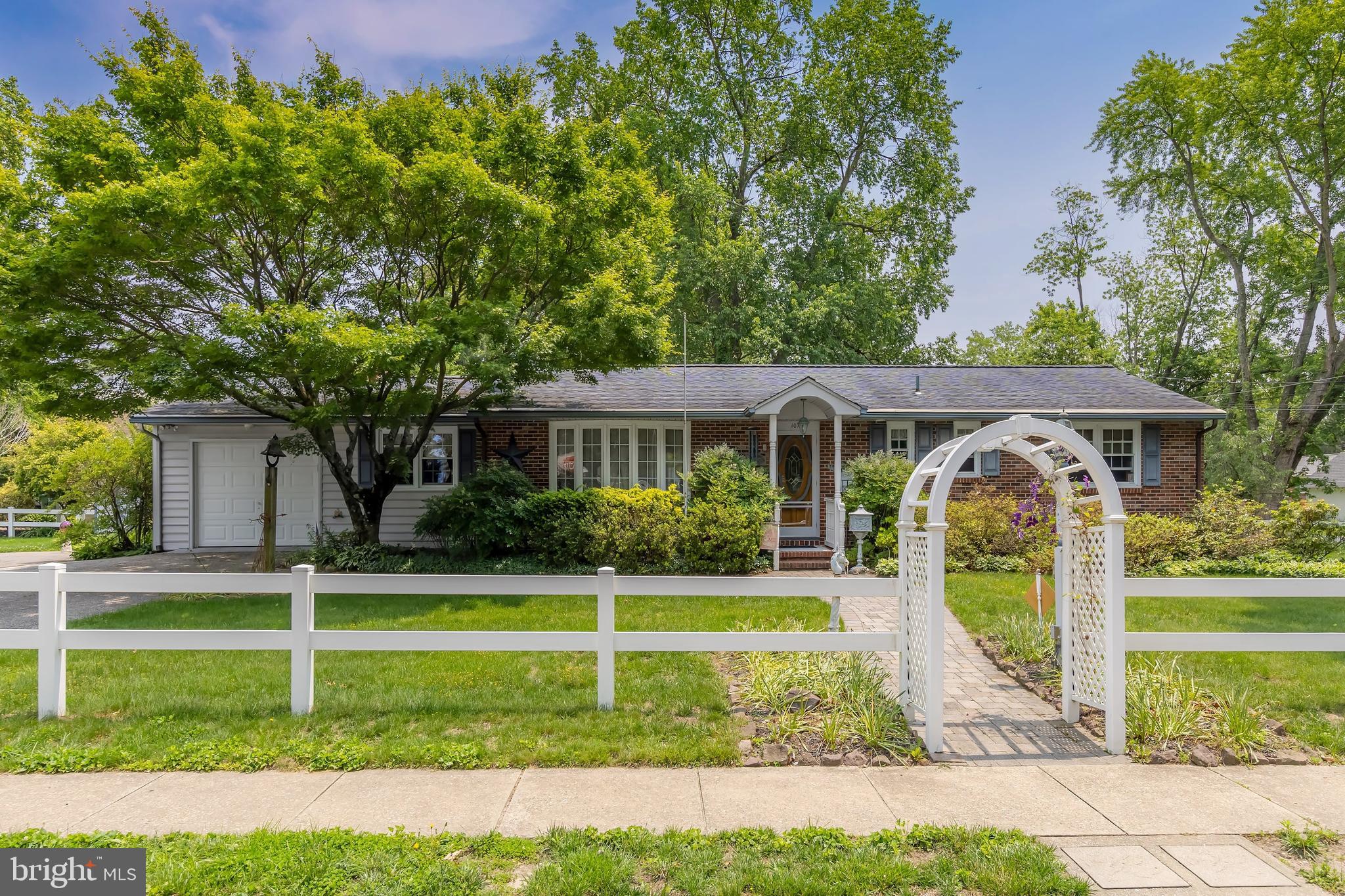 107 Elm Avenue Pitman, NJ 08071 - Photo 1 of 21 a front view of a house with a yard
