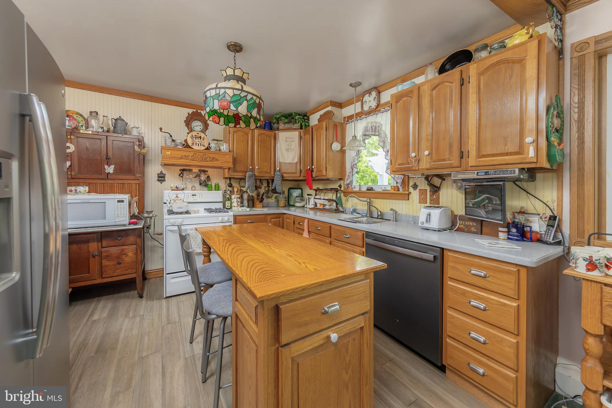 107 Elm Avenue Pitman, NJ 08071 - Photo 15 of 21 a kitchen with a sink stove and refrigerator