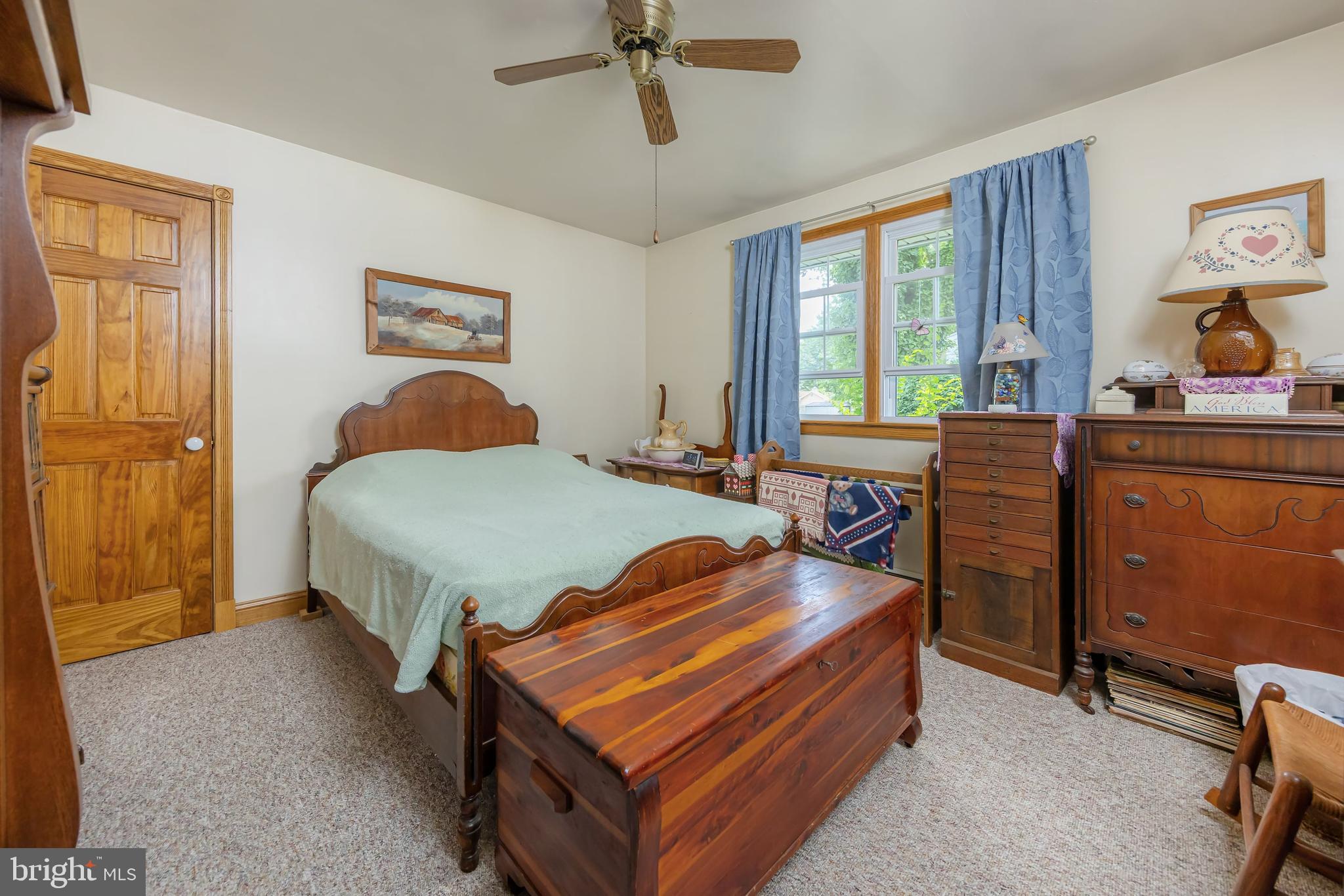 107 Elm Avenue Pitman, NJ 08071 - Photo 19 of 21 a bedroom with a bed and a dresser next to a window