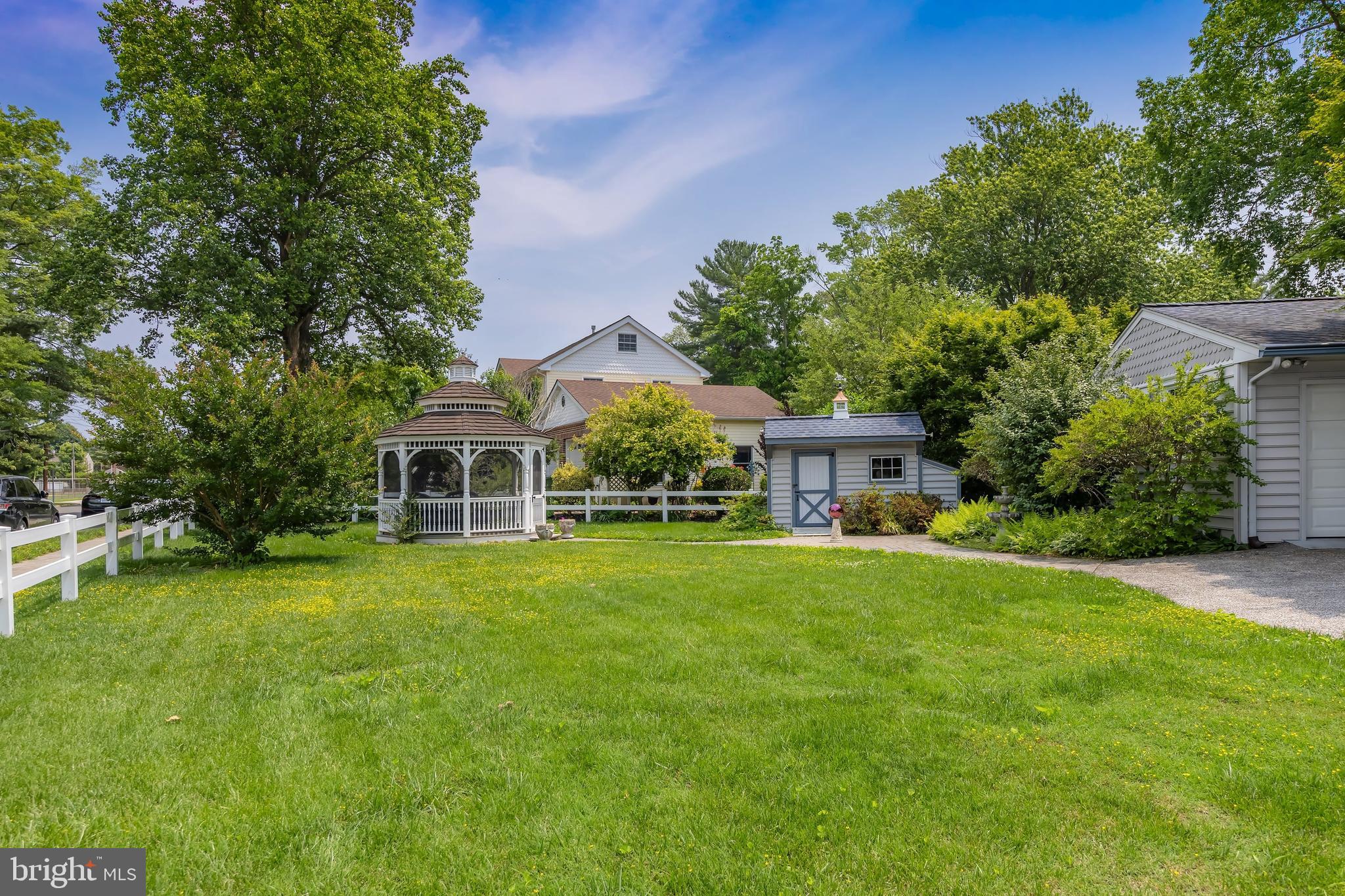 107 Elm Avenue Pitman, NJ 08071 - Photo 6 of 21 a front view of a house with a garden