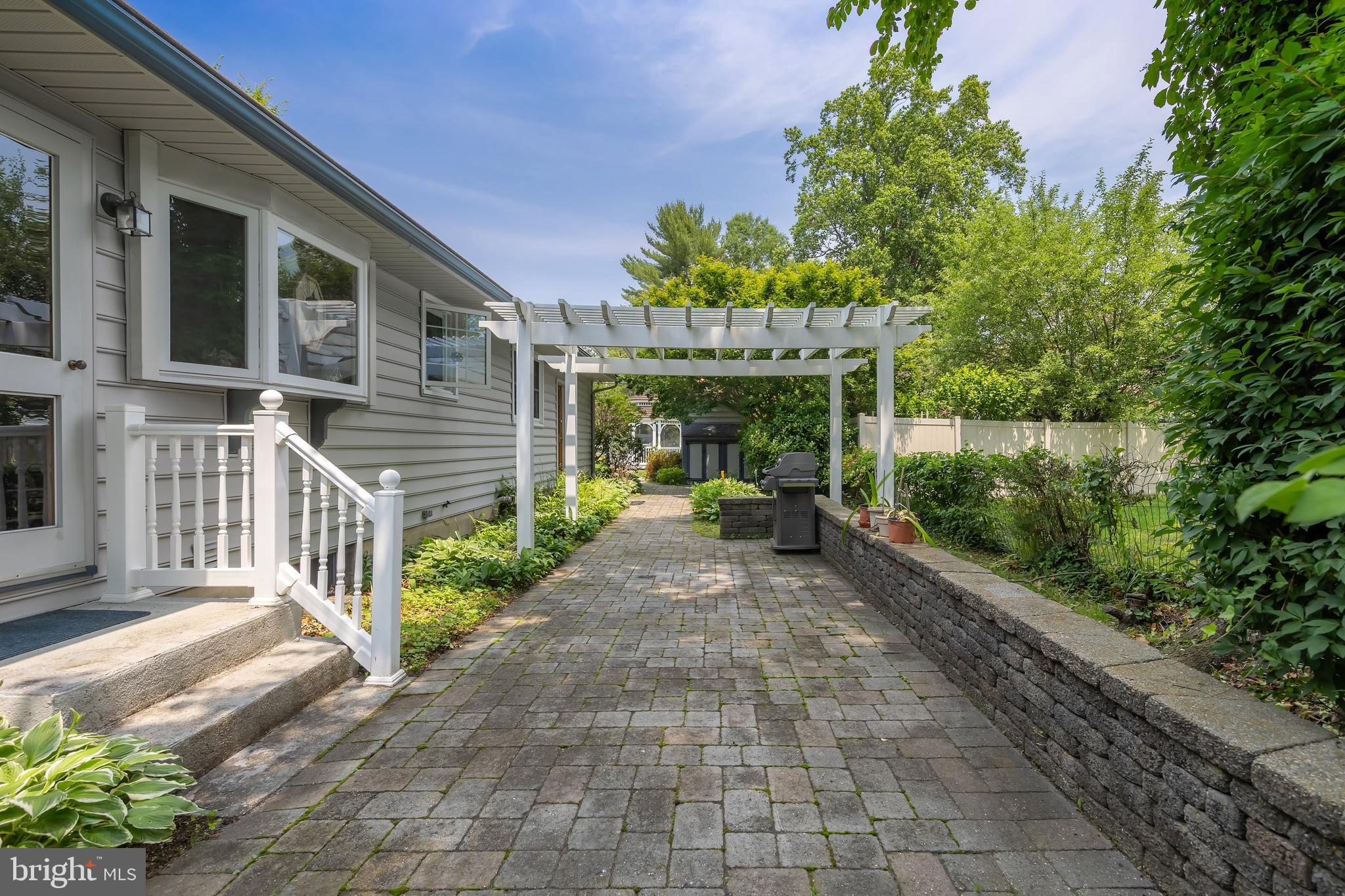 107 Elm Avenue Pitman, NJ 08071 - Photo 10 of 21 a view of a patio with table and chairs and potted plants