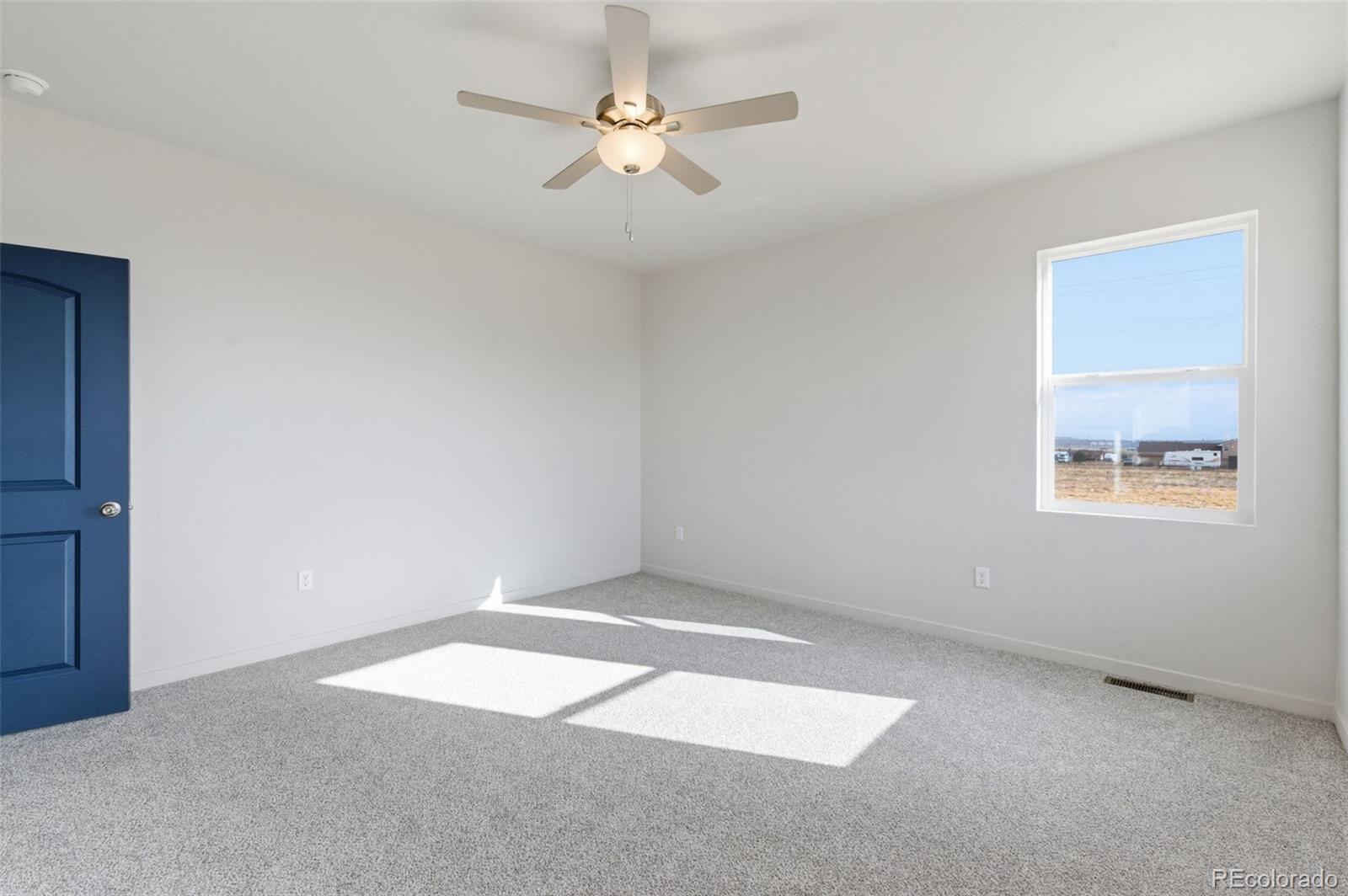 24515 Big Springs Road Peyton, CO 80831 - Photo 18 of 30 a view of an empty room with a window