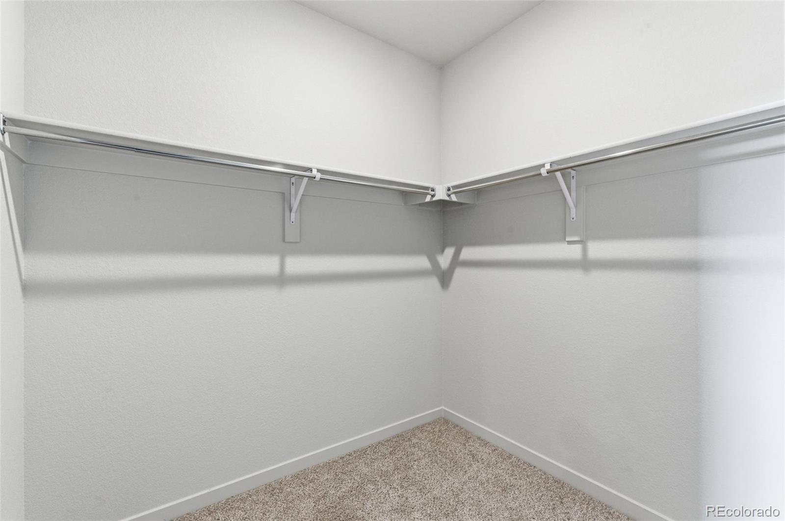 24515 Big Springs Road Peyton, CO 80831 - Photo 22 of 30 a view of a room with racks on the wall