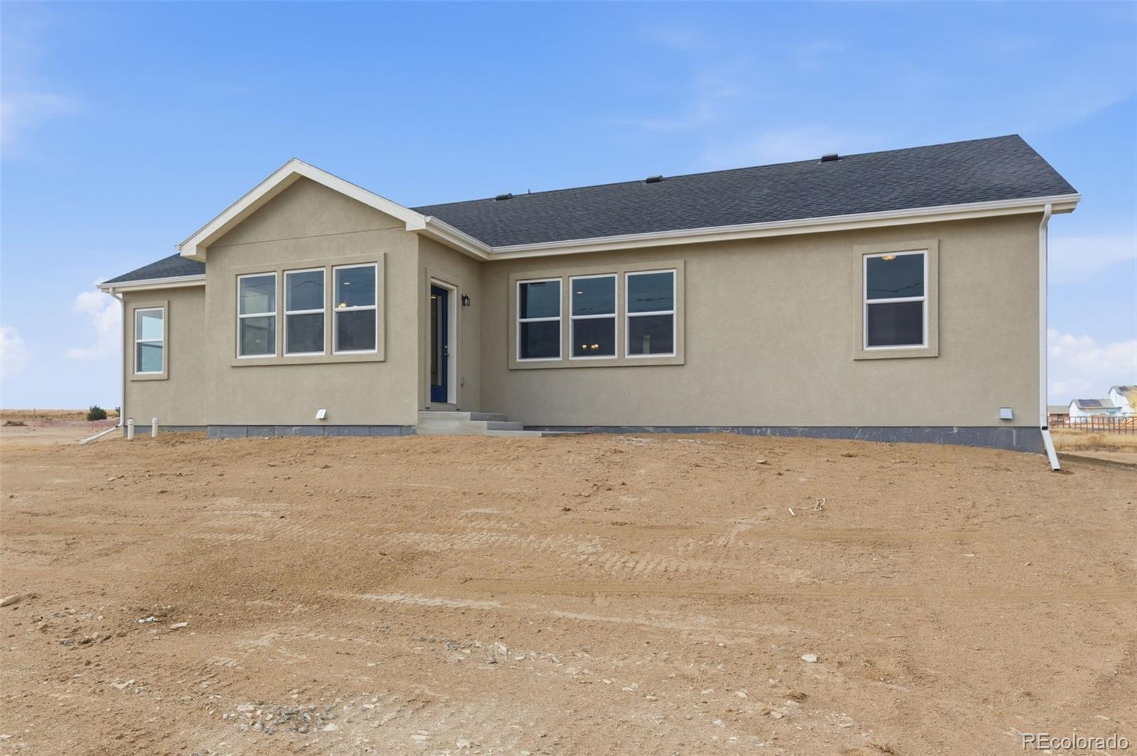24515 Big Springs Road Peyton, CO 80831 - Photo 28 of 30 a front view of house with yard