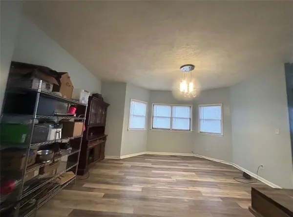 a view of a livingroom with furniture and closet