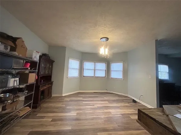 a large kitchen with cabinets and stainless steel appliances