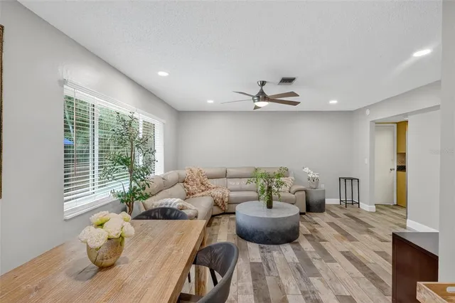 a kitchen with a refrigerator a stove a sink and a window