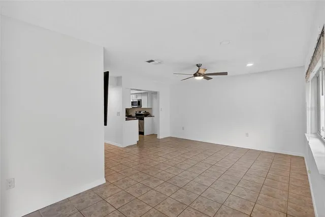 a front view of a house with a yard and a garden