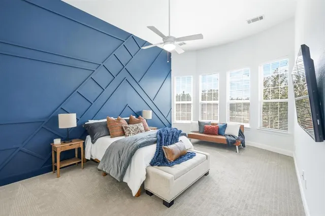 a kitchen with sink stove and large window