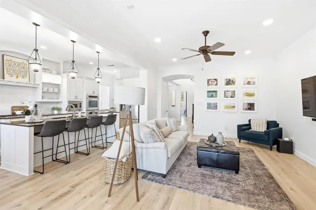 a living room with lots of furniture and a rug