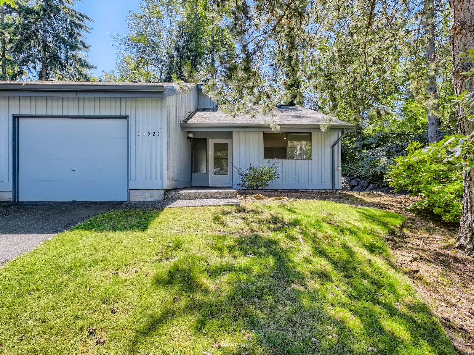 11521 Southeast 175th Street Renton, WA 98058 - Photo 1 of 20 a front view of house with yard