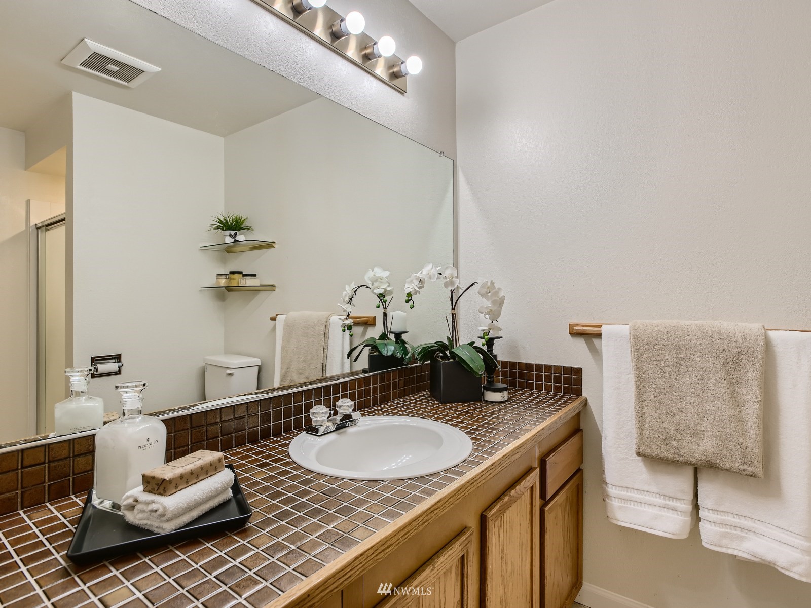 11521 Southeast 175th Street Renton, WA 98058 - Photo 11 of 20 a bathroom with sink and mirror