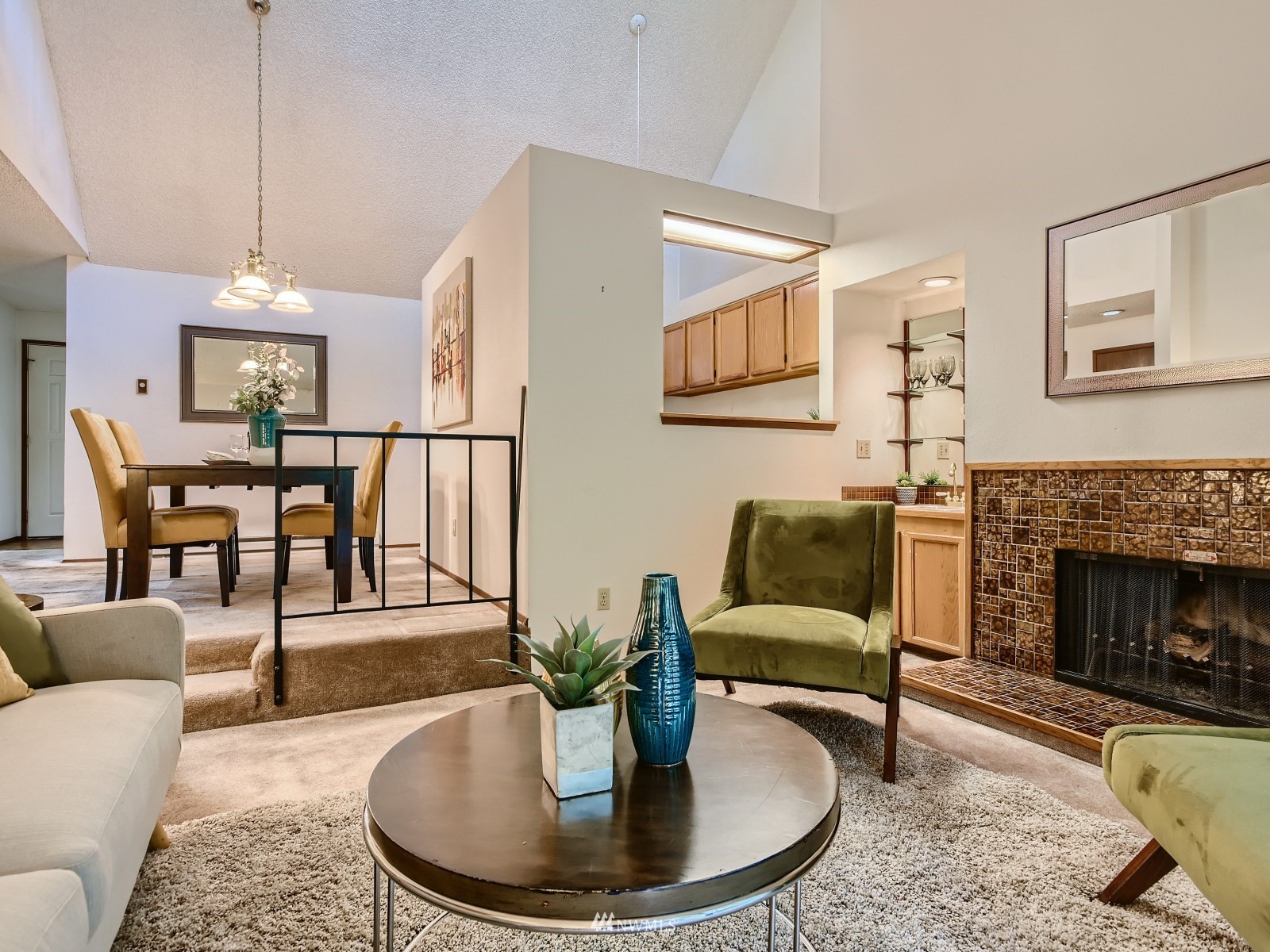11521 Southeast 175th Street Renton, WA 98058 - Photo 4 of 20 a living room with furniture and a fireplace