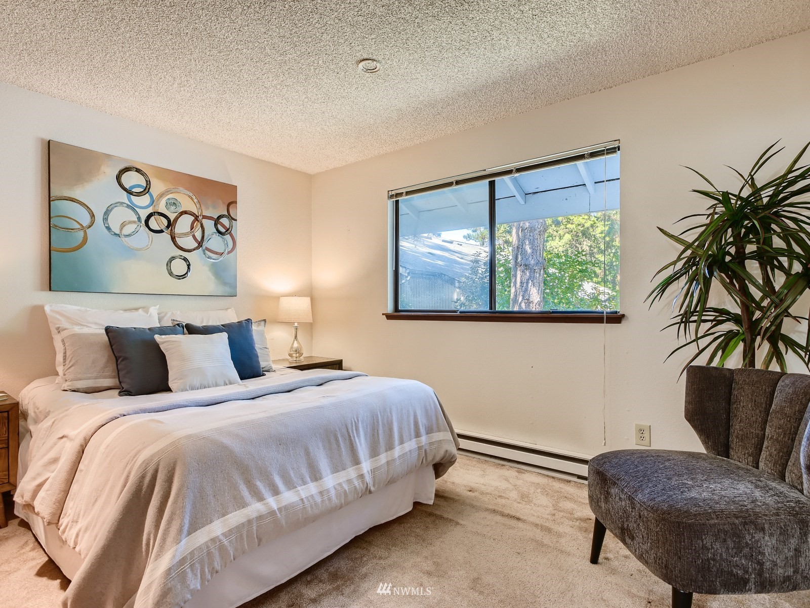 11521 Southeast 175th Street Renton, WA 98058 - Photo 9 of 20 a bedroom with a bed and a couch