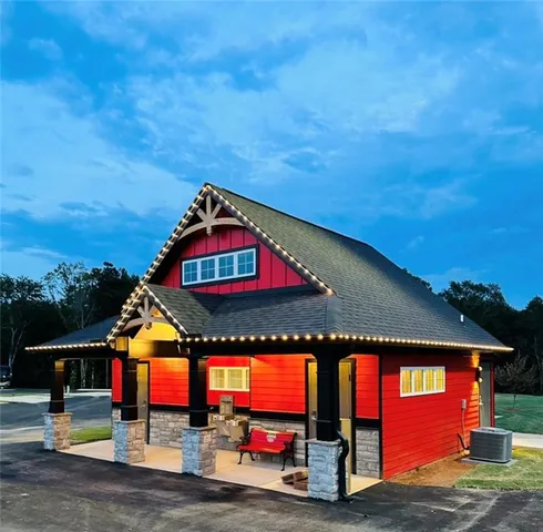 a view of swimming pool with an outdoor seating