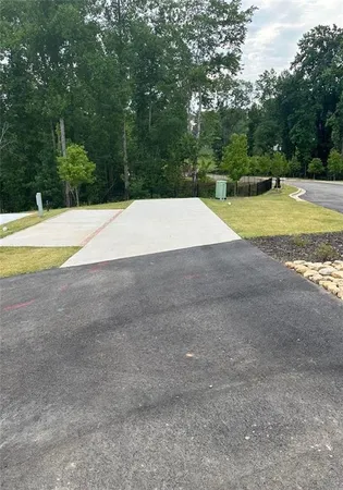 a view of a swimming pool with a yard