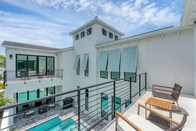 a spacious bathroom with a tub sink and mirror