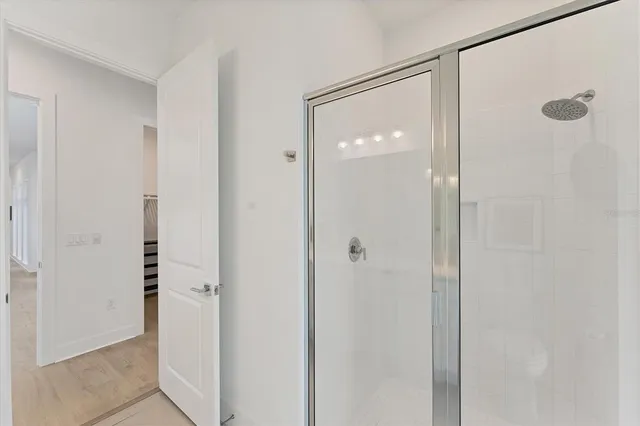 a bathroom with a sink vanity and a mirror