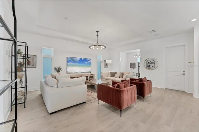 a living room with furniture and a window