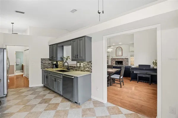 a kitchen with a sink and cabinets