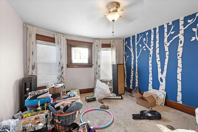 a bedroom with furniture and a chandelier